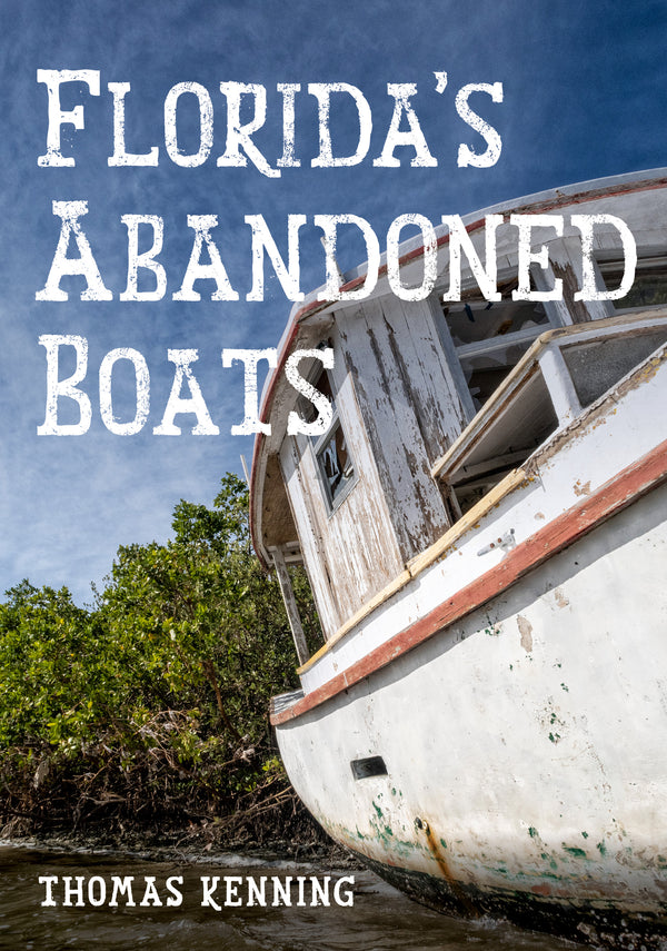 Abandoned boat on a riverbank with text overlay 'Florida's Abandoned Boats' and author name Thomas Kenning.