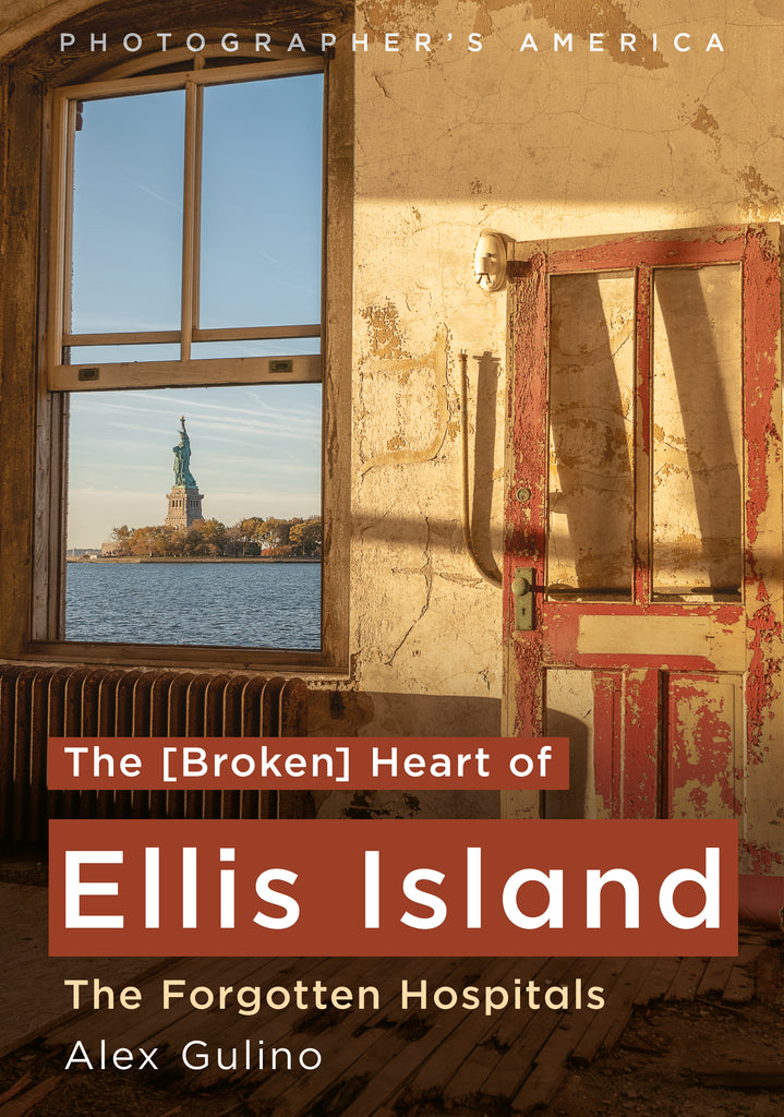 Book cover for 'The [Broken] Heart of Ellis Island: The Forgotten Hospitals' by Alex Gulino, featuring a photograph of the Statue of Liberty seen through a window in a weathered building, with a red door on the right.