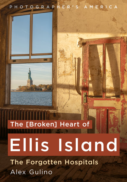 Book cover for 'The [Broken] Heart of Ellis Island: The Forgotten Hospitals' by Alex Gulino, featuring a photograph of the Statue of Liberty seen through a window in a weathered building, with a red door on the right.