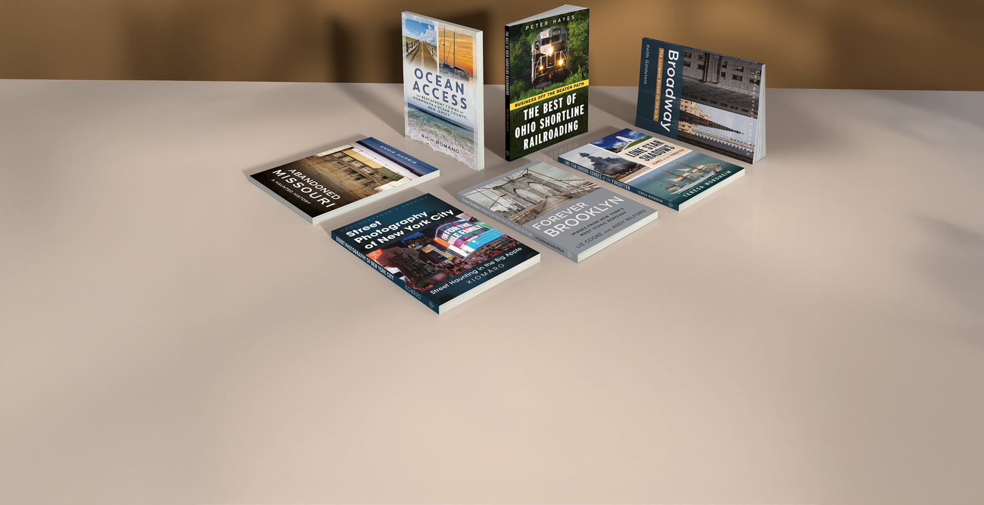Collection of books on a flat surface with a neutral background. Published by America Through Time - local history publisher, an imprint of Sutton Publishing Inc.