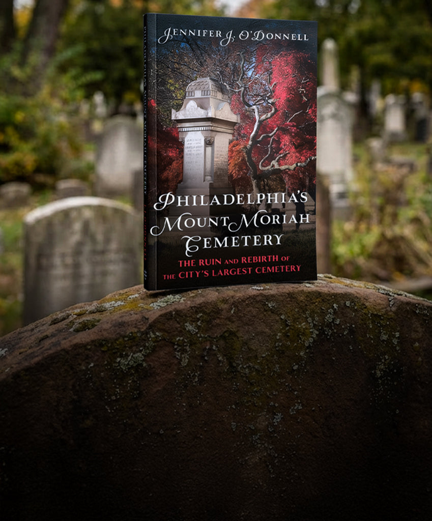 Book titled 'Philadelphia's Mount Moriah Cemetery' by Jennifer O'Donnell on a gravestone with a cemetery background.