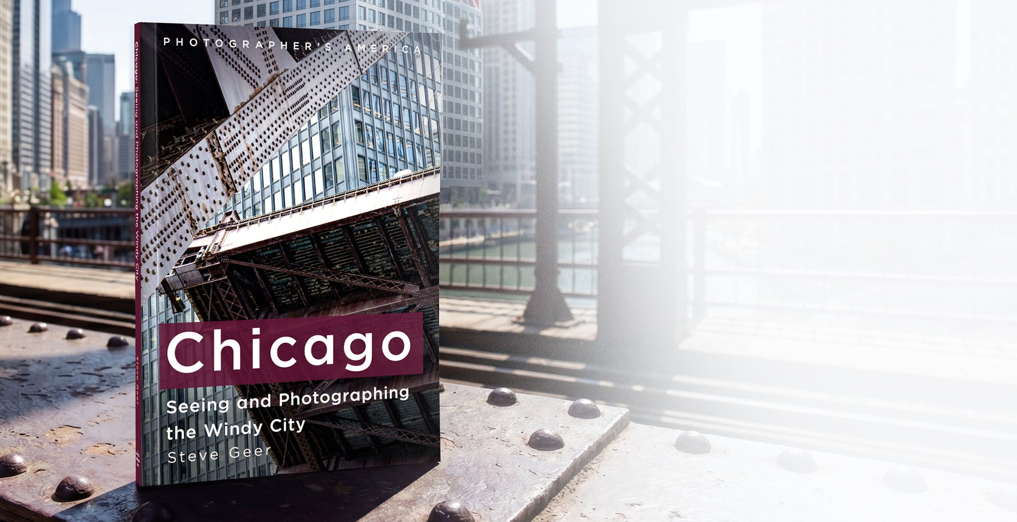 Book titled 'Chicago: Seeing and Photographing the Windy City' by Steve Eicher on a city street background.